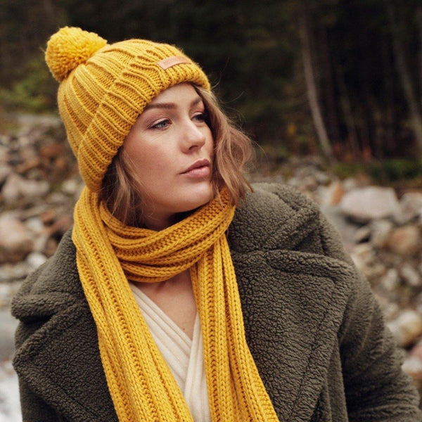 Woman wearing Ochre Yellow Chic Rib Knit Beanie With Pom and scarf